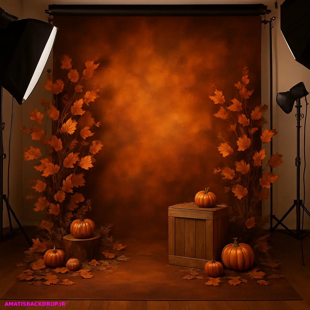 دکور آتلیه پاییزی با برگهای خشک و رنگهای نارنجی و قهوهای که فضای آرام و دلنشینی را ایجاد کرده است.